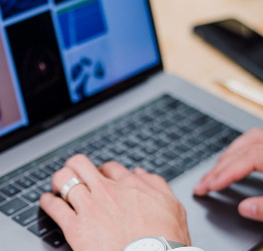 IT Worker searching for remote tech jobs on his laptop